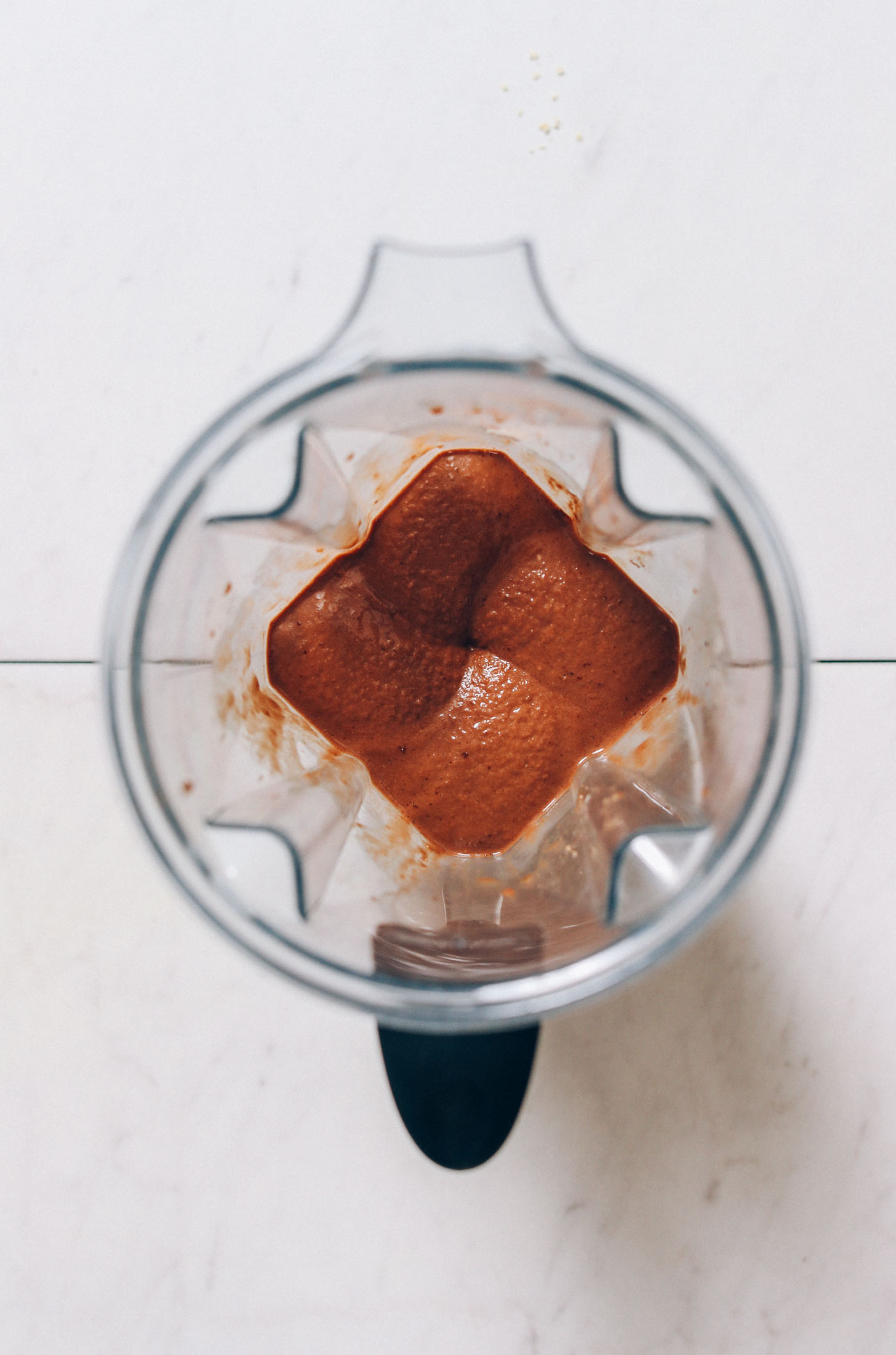 Blender of our creamy chocolate banana shake made with adaptogens