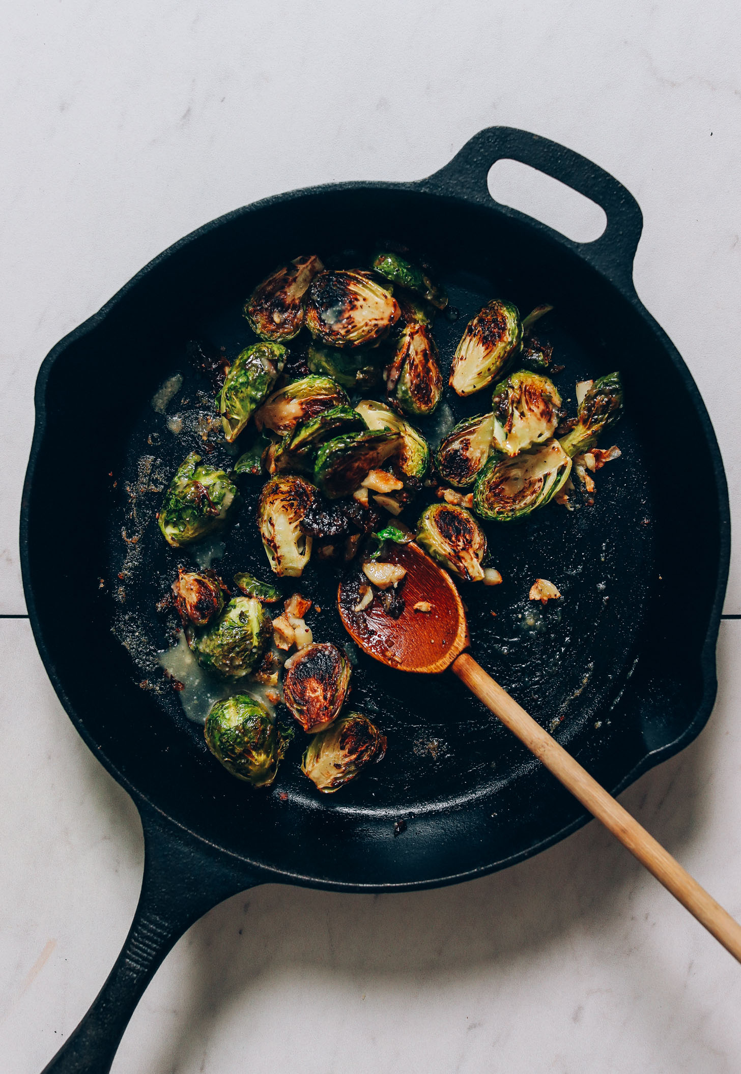 Cast iron pan of crispy miso brussels sprouts
