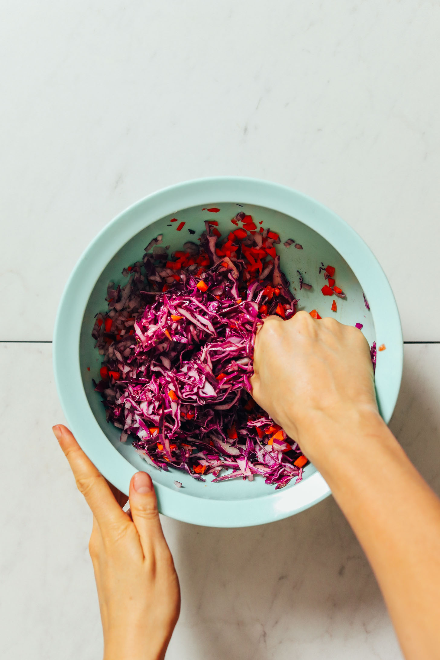 Massaging cabbage for tender Cabbage Slaw