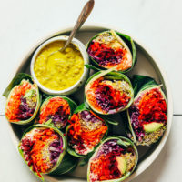 Plate of Collard Green Wraps with Green Curry Tahini Dressing