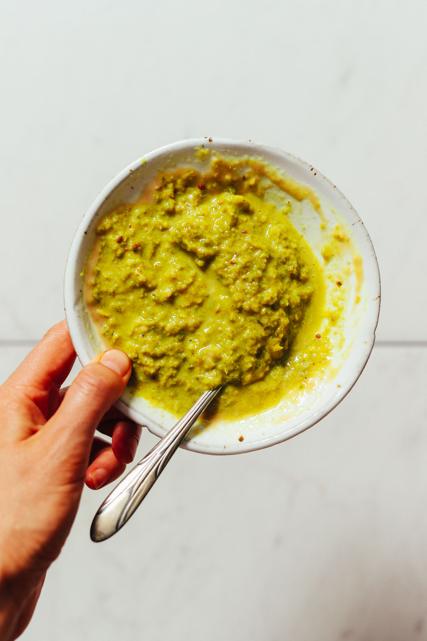 Bowl of green curry tahini sauce
