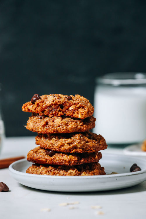 Stack of Pumpkin Chocolate Chip Cookies next to dairy-free milk