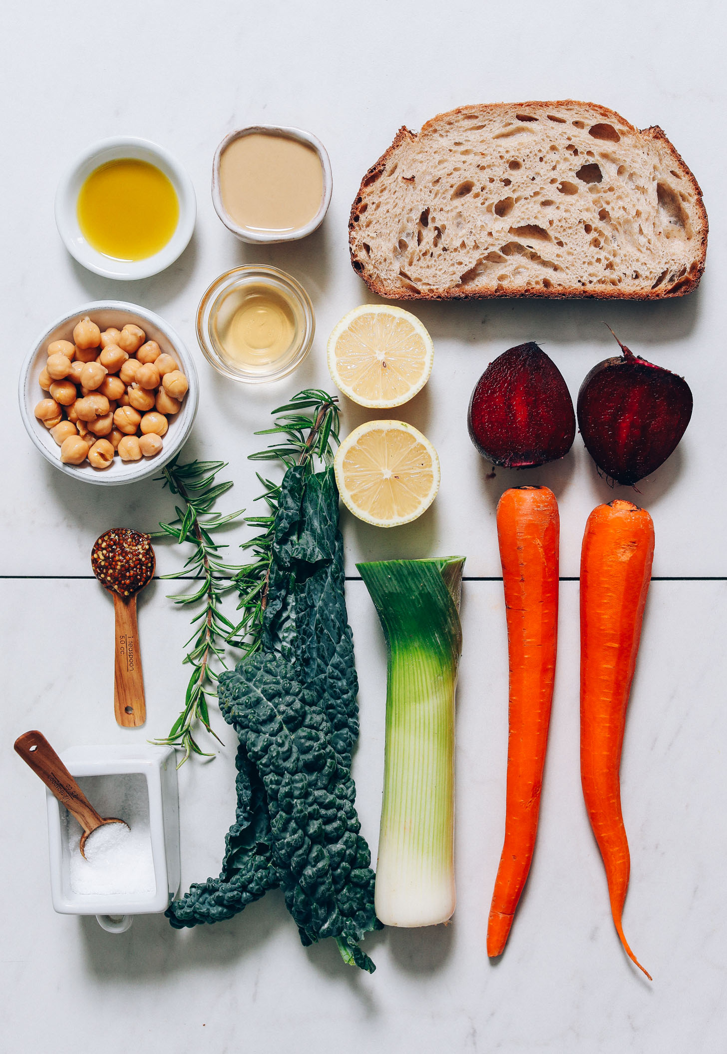 Olive oil, tahini, sourdough bread, chickpeas, apple cider vinegar, lemon, beets, carrots, leeks, kale, rosemary, mustard, and sea salt