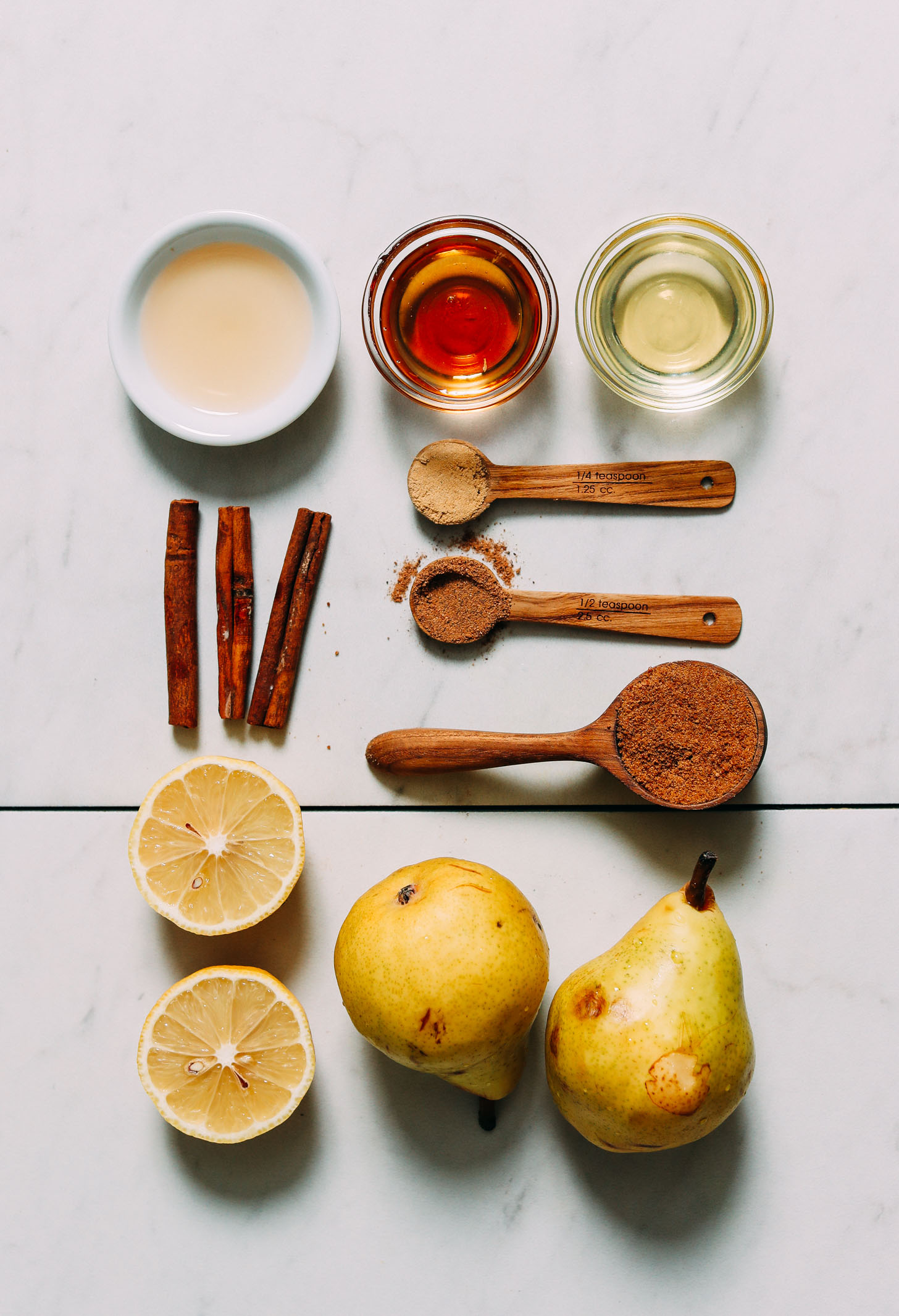 Avocado oil, maple syrup, apple cider vinegar, ginger, cinnamon, nutmeg, coconut sugar, pears, and lemons