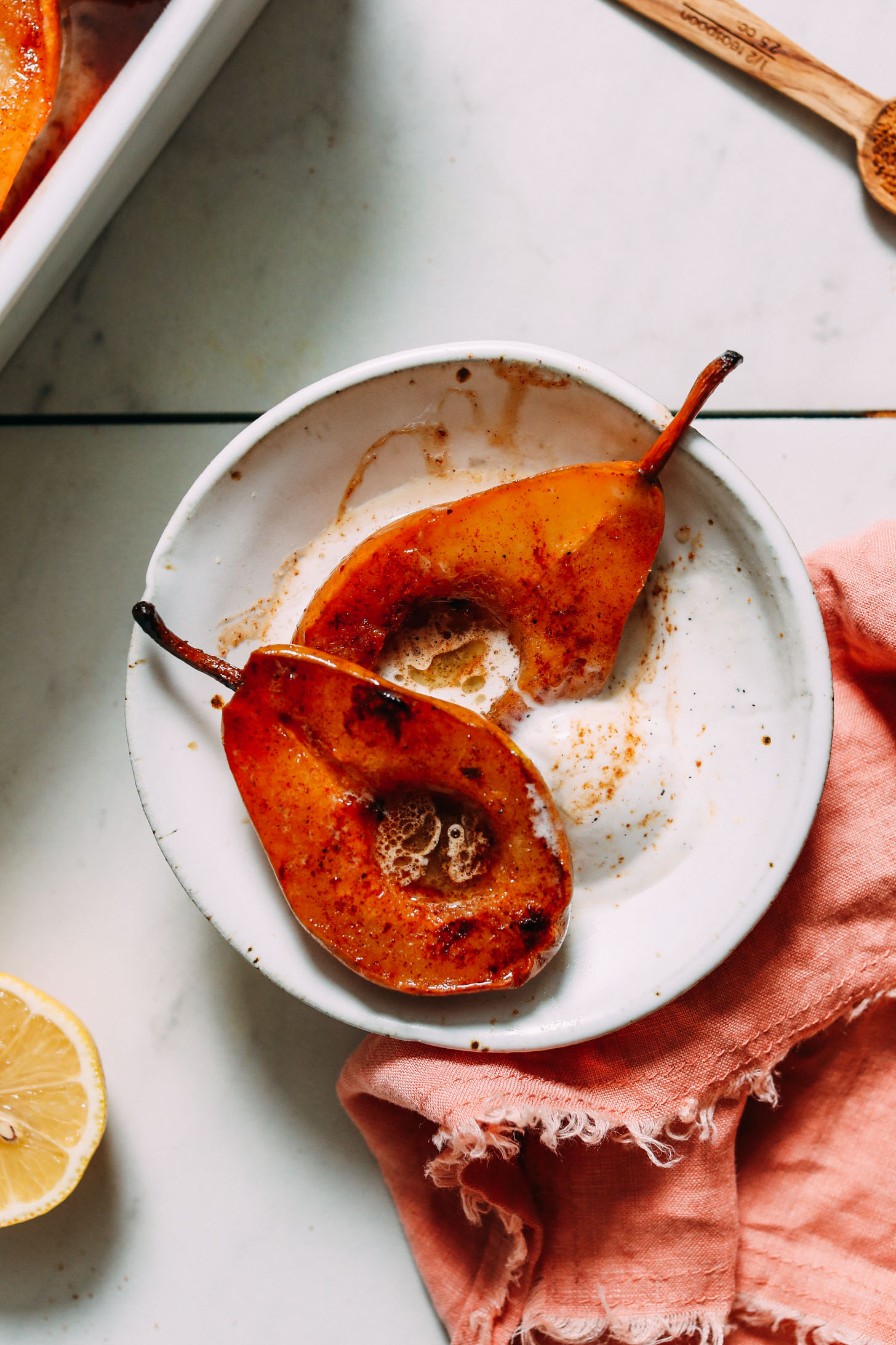 Bowl of cinnamon baked pears and vegan vanilla ice cream