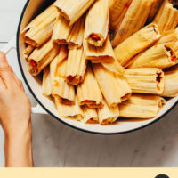 Holding a Dutch oven filled with homemade tamales