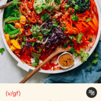Mango and fresh vegetables with peanut sauce on a large tray