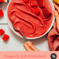 Bowl of Strawberry Watermelon Sorbet topped with watermelon and strawberry chunks
