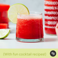 Glass of watermelon juice with a lime slice on the rim