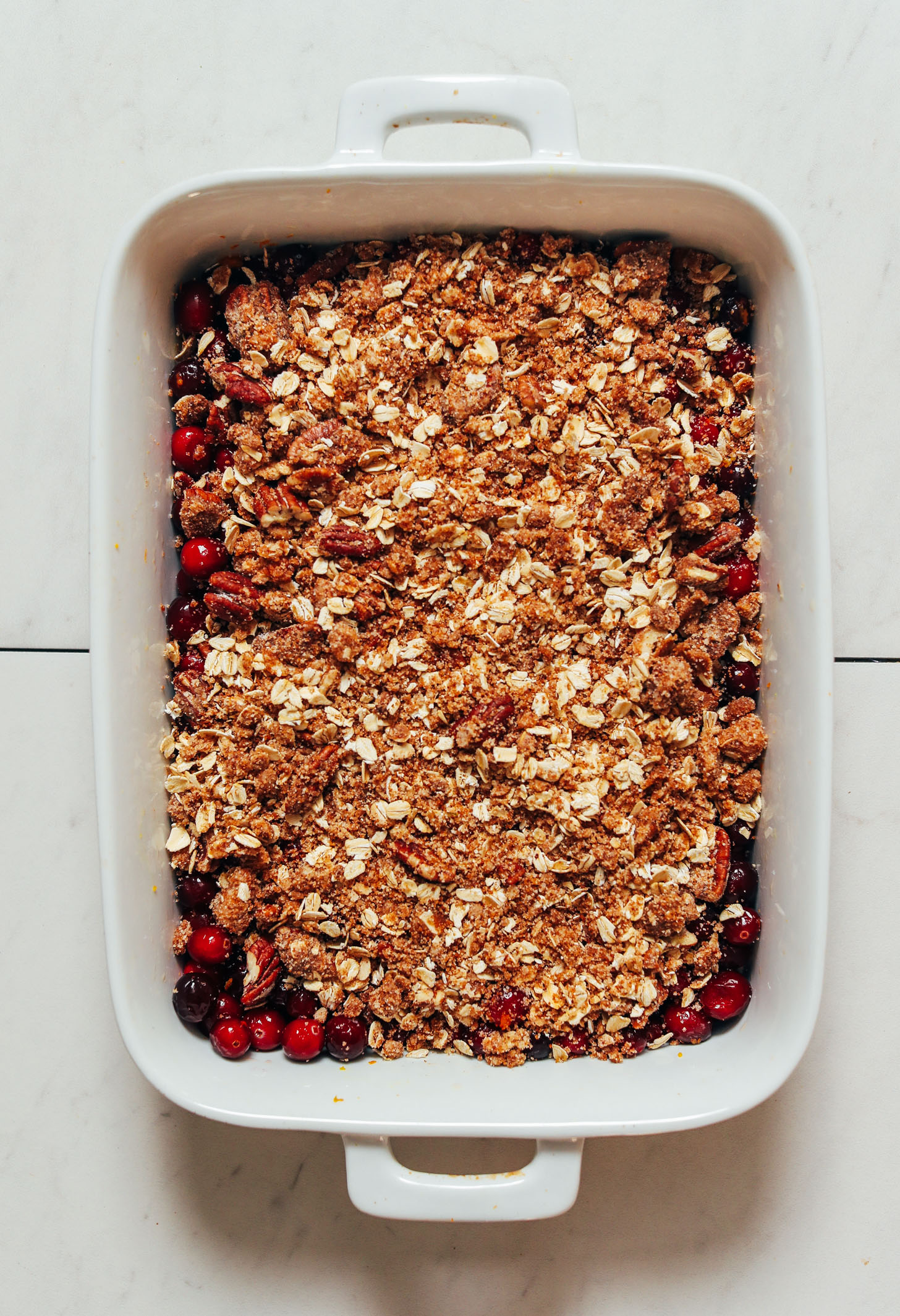 Gluten-free oat and almond flour topping over a cranberry orange filling