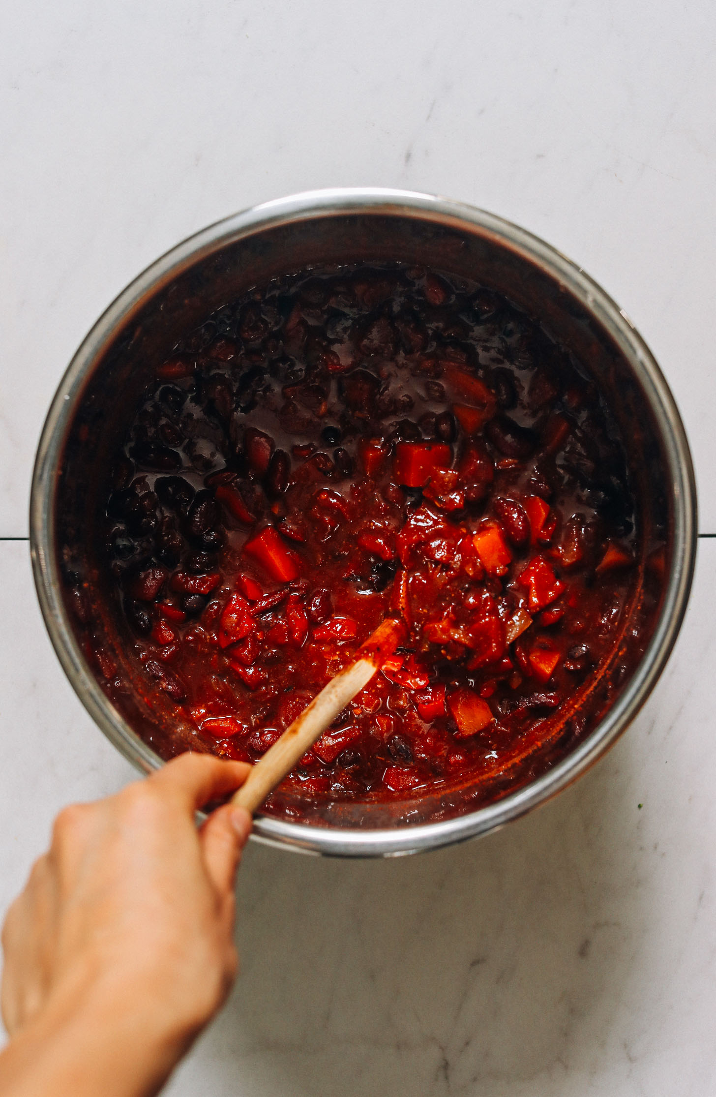 Stirring vegan Instant Pot chili
