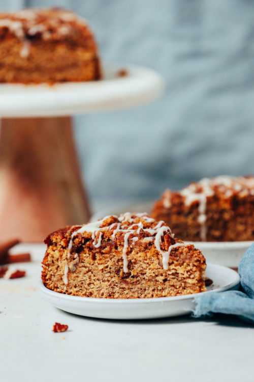 Cake stand and plate with slices of vegan gluten-free coffee cake
