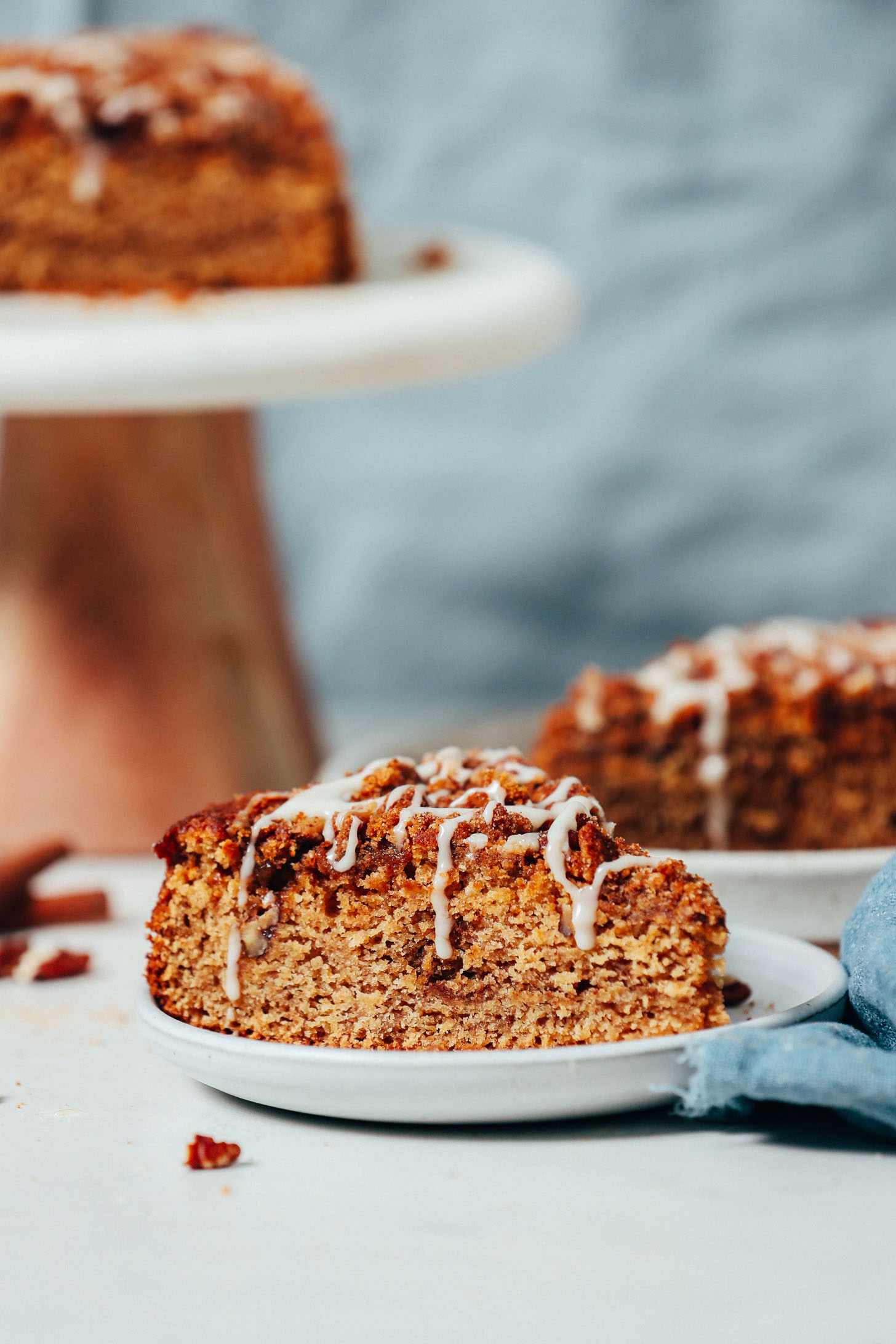 Gluten-free vegan coffee cake slices drizzled with glaze