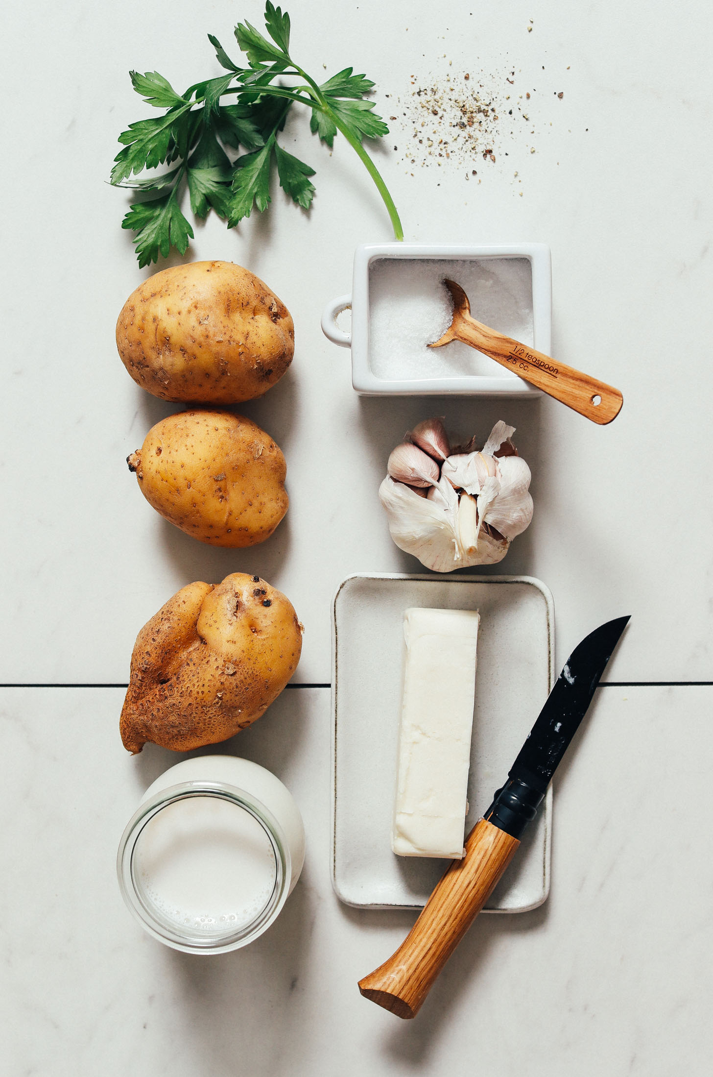Parsley, salt, pepper, garlic, vegan butter, dairy-free milk, and potatoes