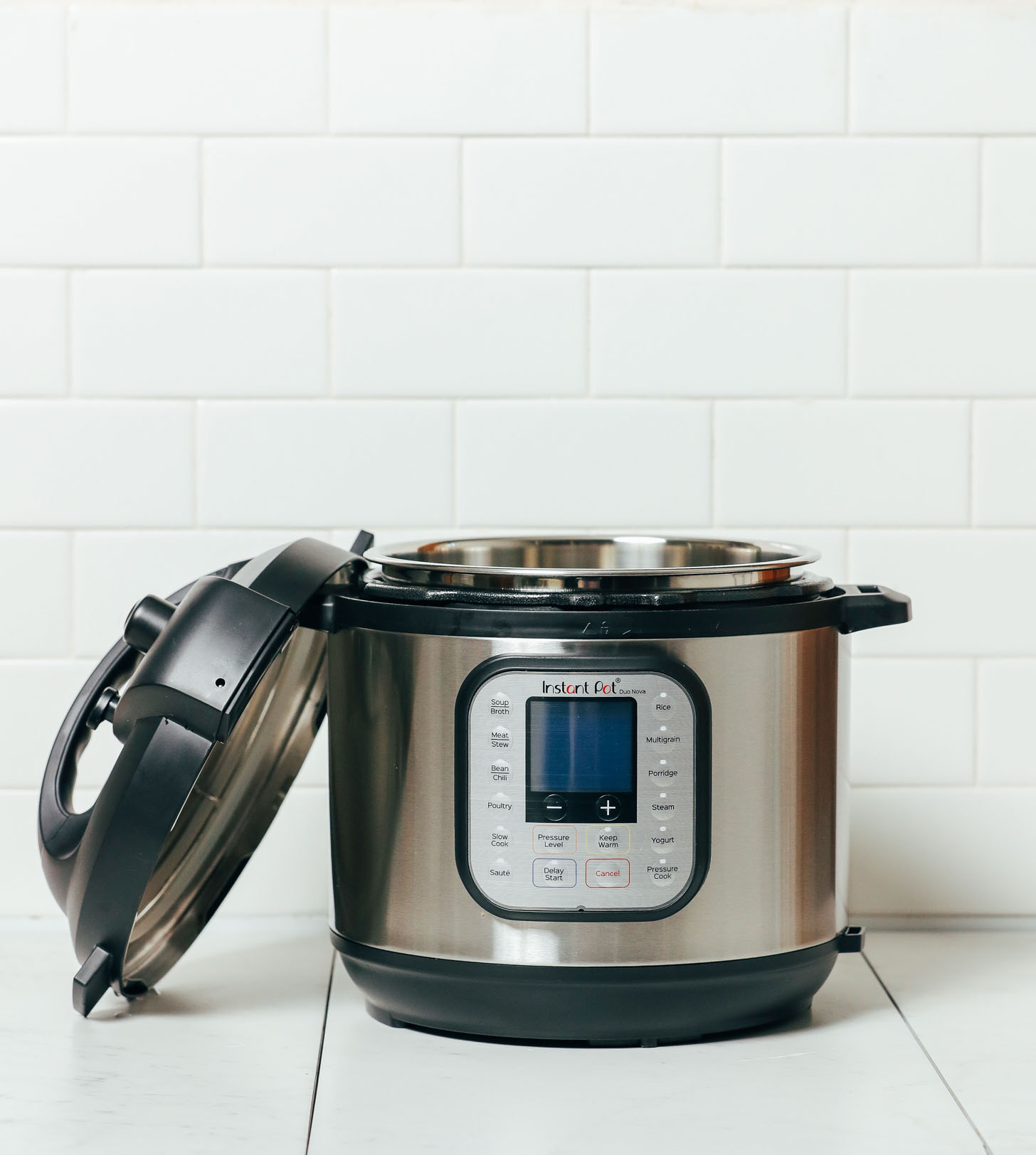 Open Instant Pot with lid resting against the base