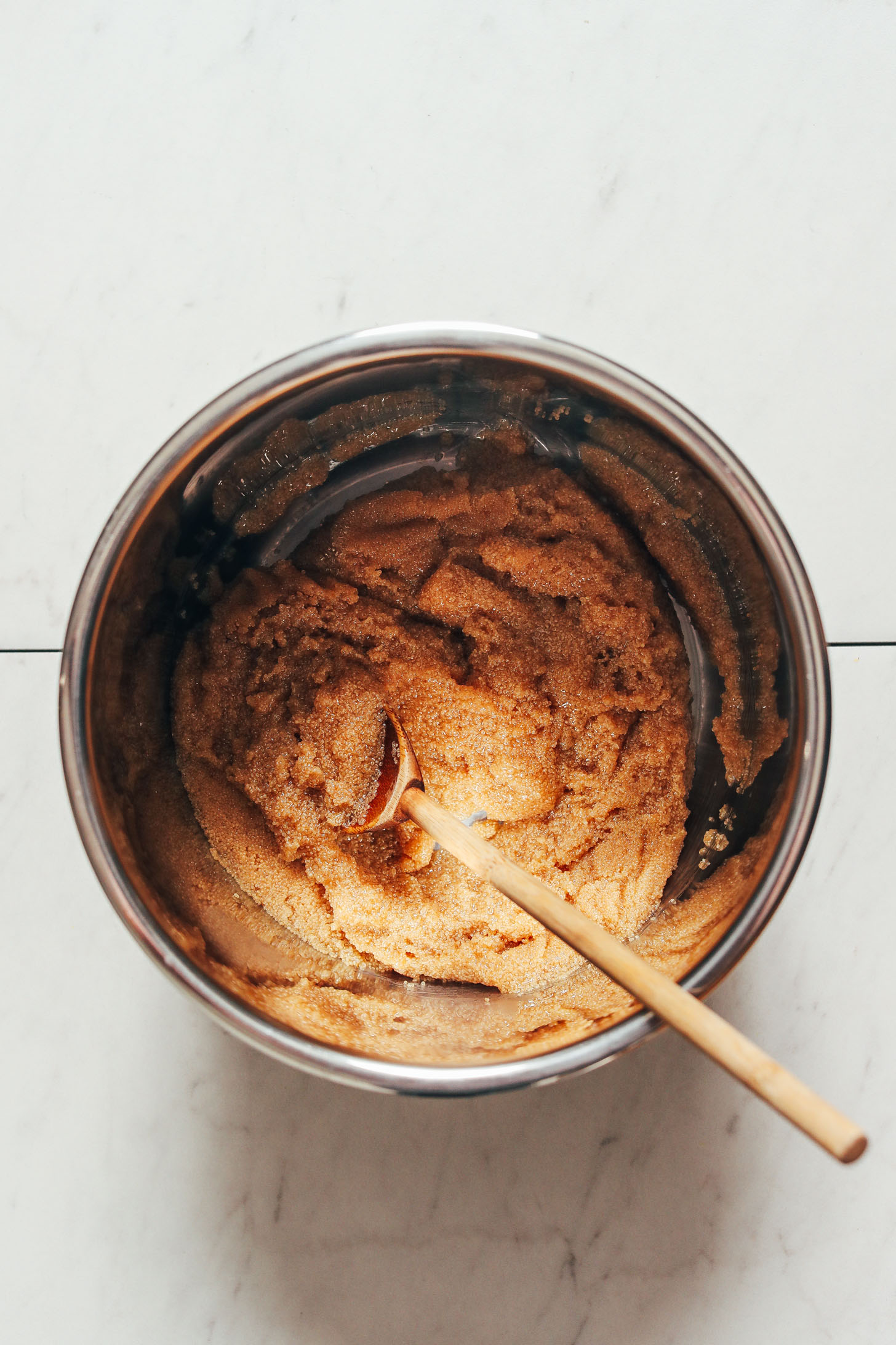 Wooden spoon resting in amaranth in an Instant Pot