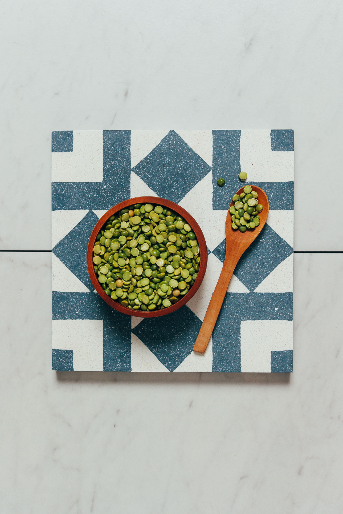 Bowl and spoonful of dry green split peas