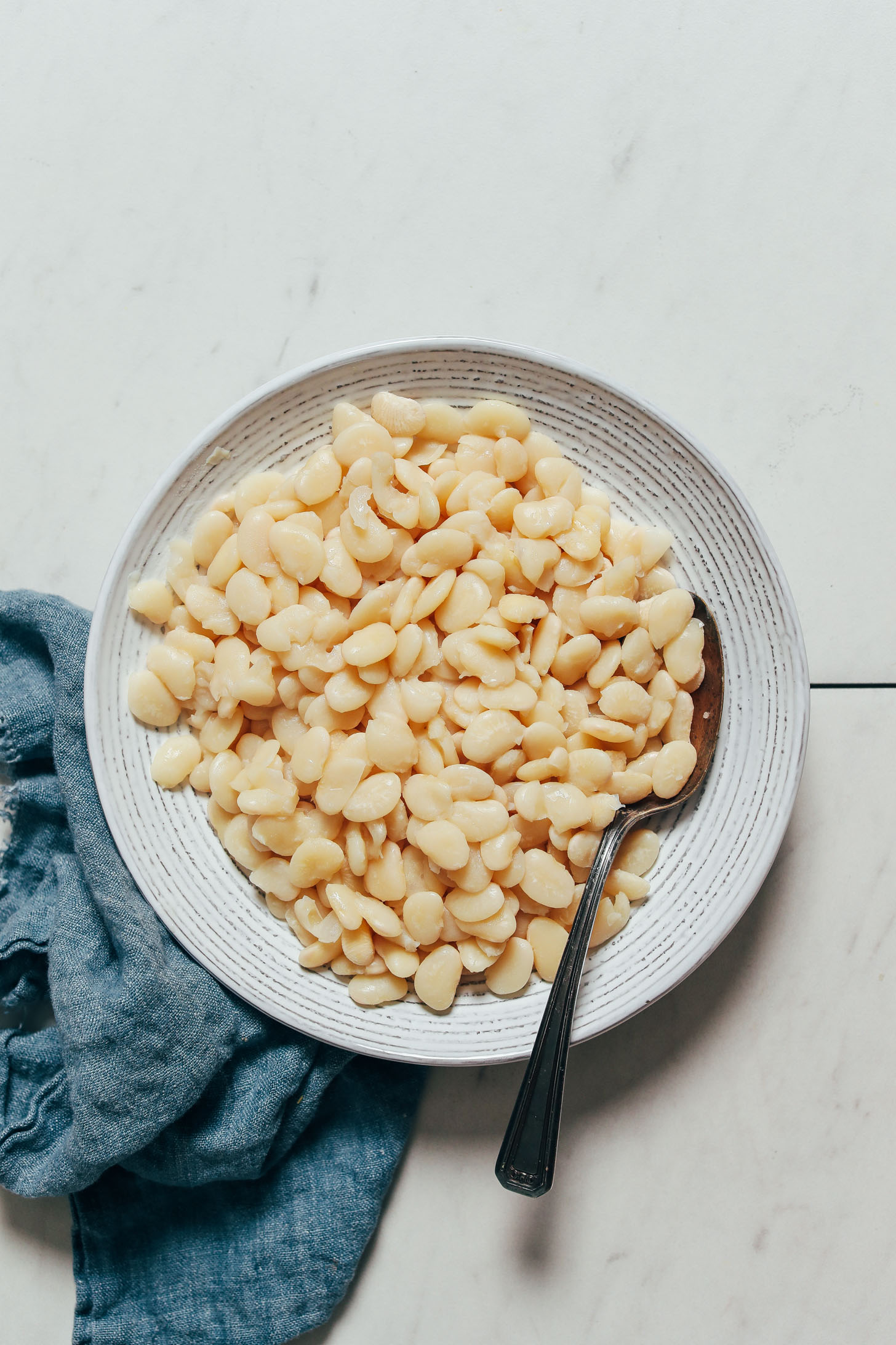 Vintage spoon in a bowl of perfect Instant Pot lima beans