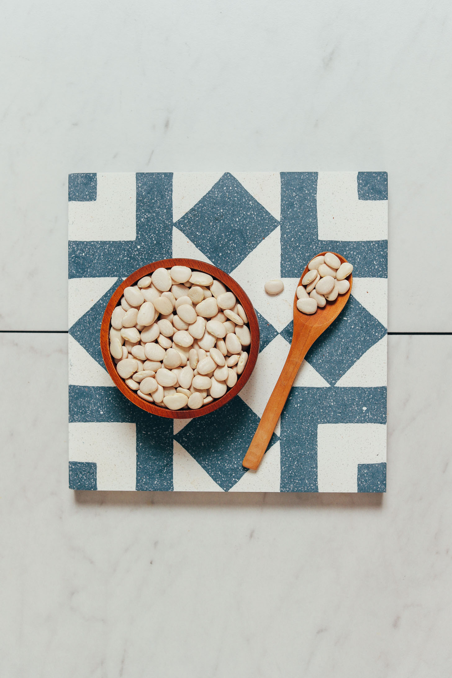 Spoon and bowl of baby white lima beans