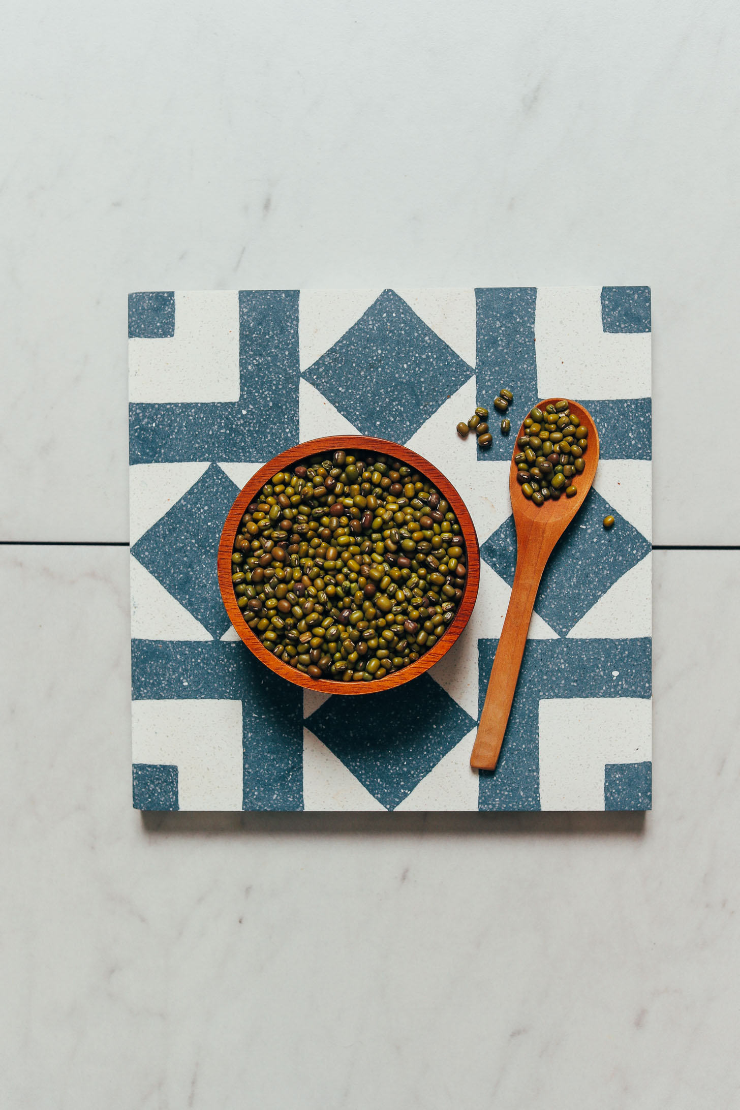 Spoonful and bowl of green mung beans