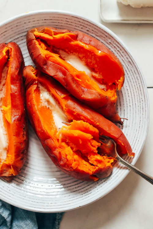 Bowl of sweet potatoes topped with vegan butter