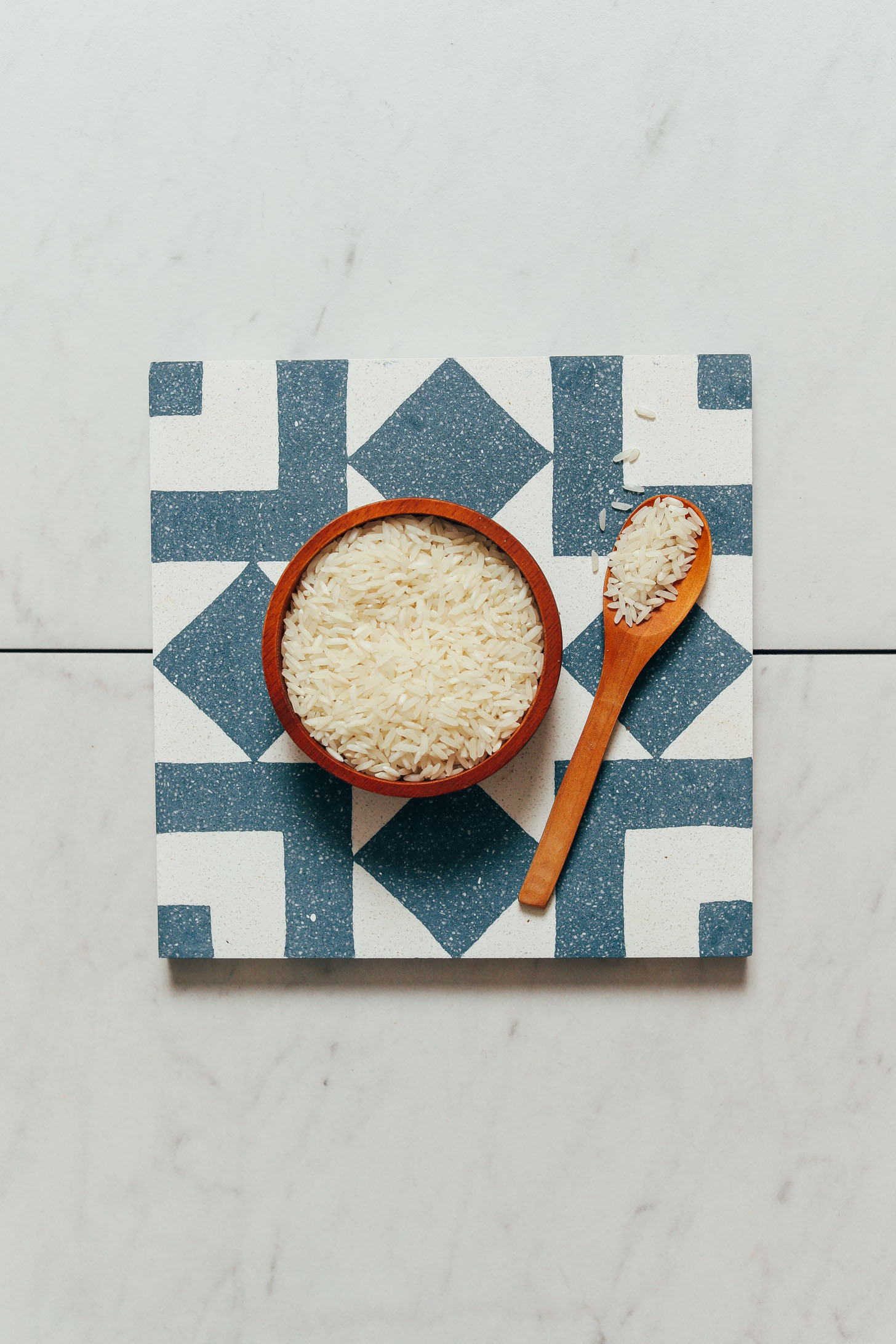 Bowl and spoon of dry white rice