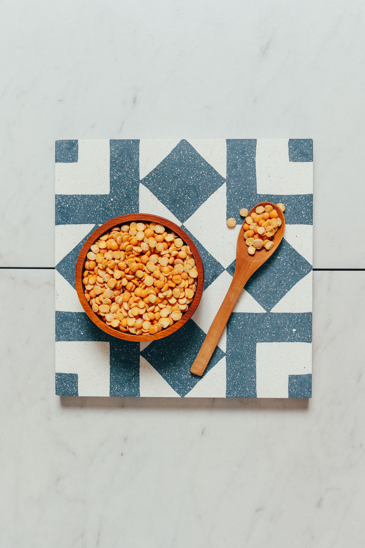 Spoon and bowl of dry yellow split peas