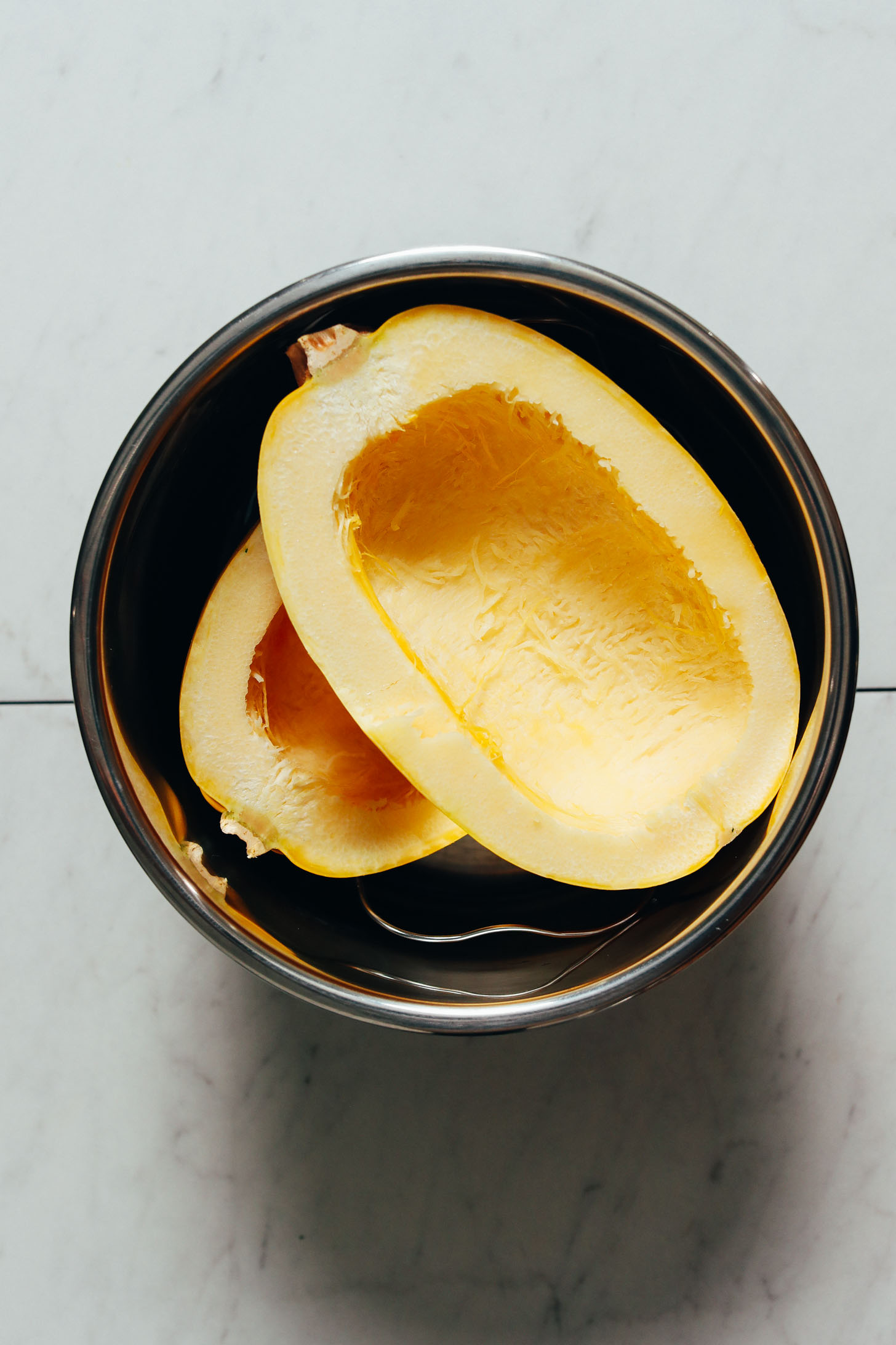 Halved, deseeded spaghetti squash in the Instant Pot