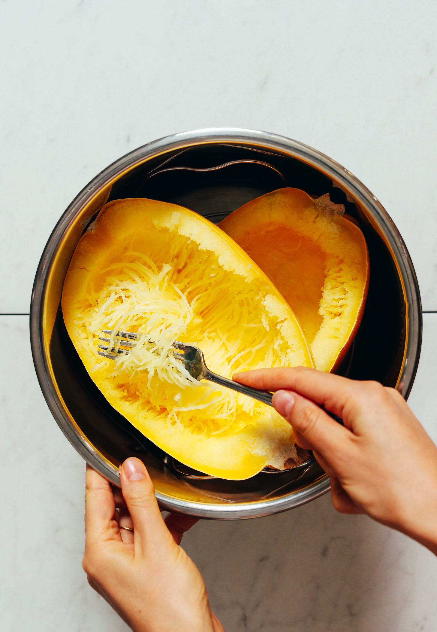 Using a fork to create spaghetti squash strands