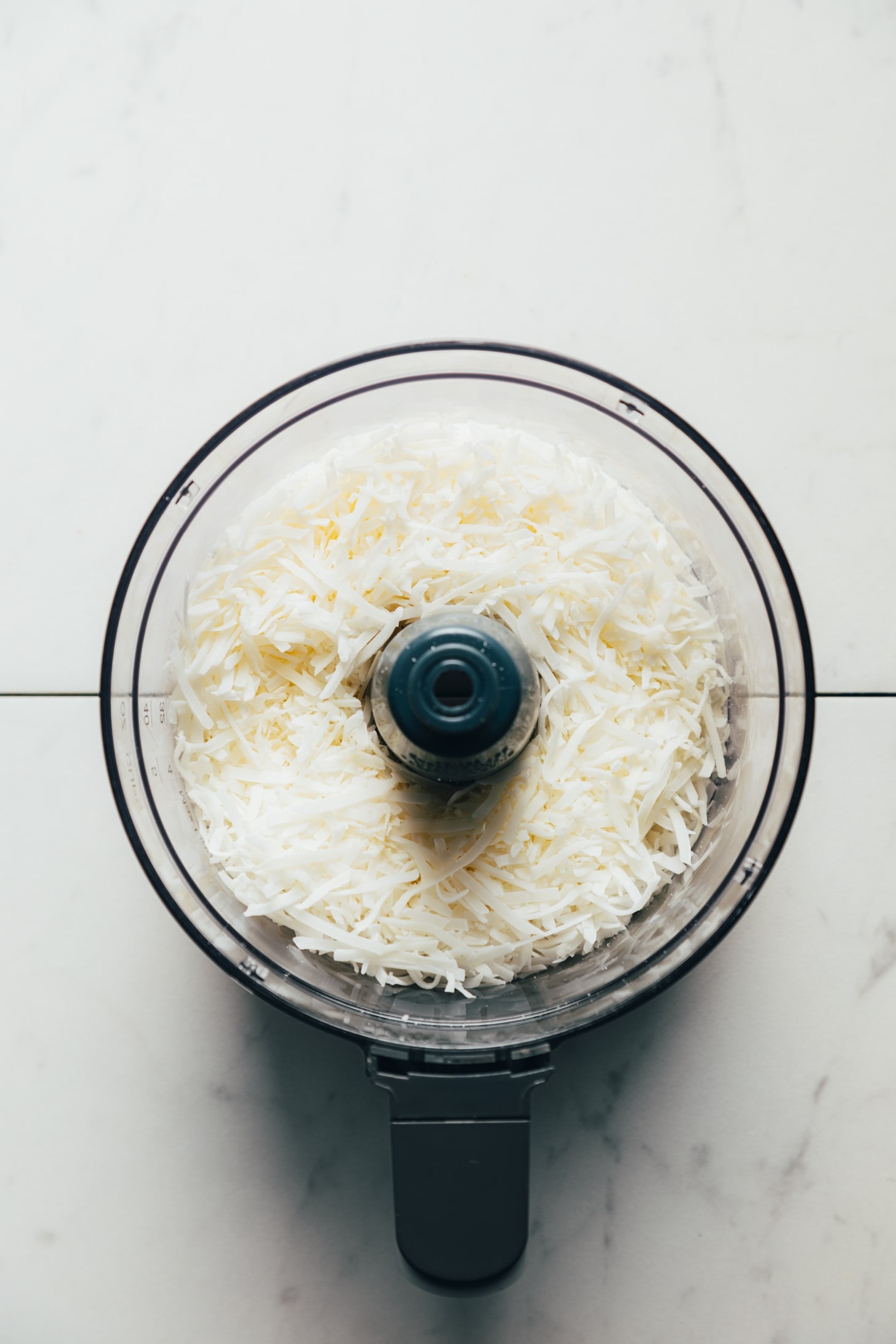 Shredded coconut in a food processor