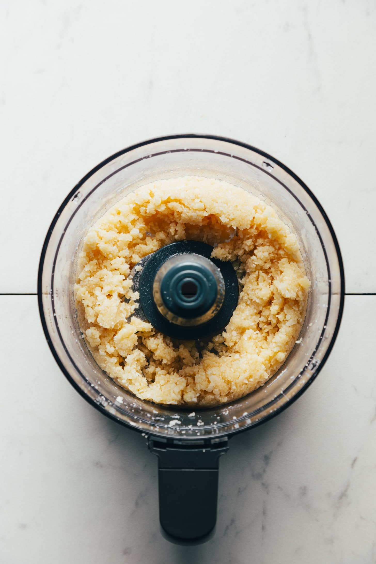 Coconut-based dough in the food processor for making peppermint patties