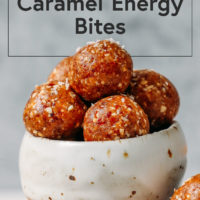 Small bowl piled high with Salted Caramel Cashew Energy Bites