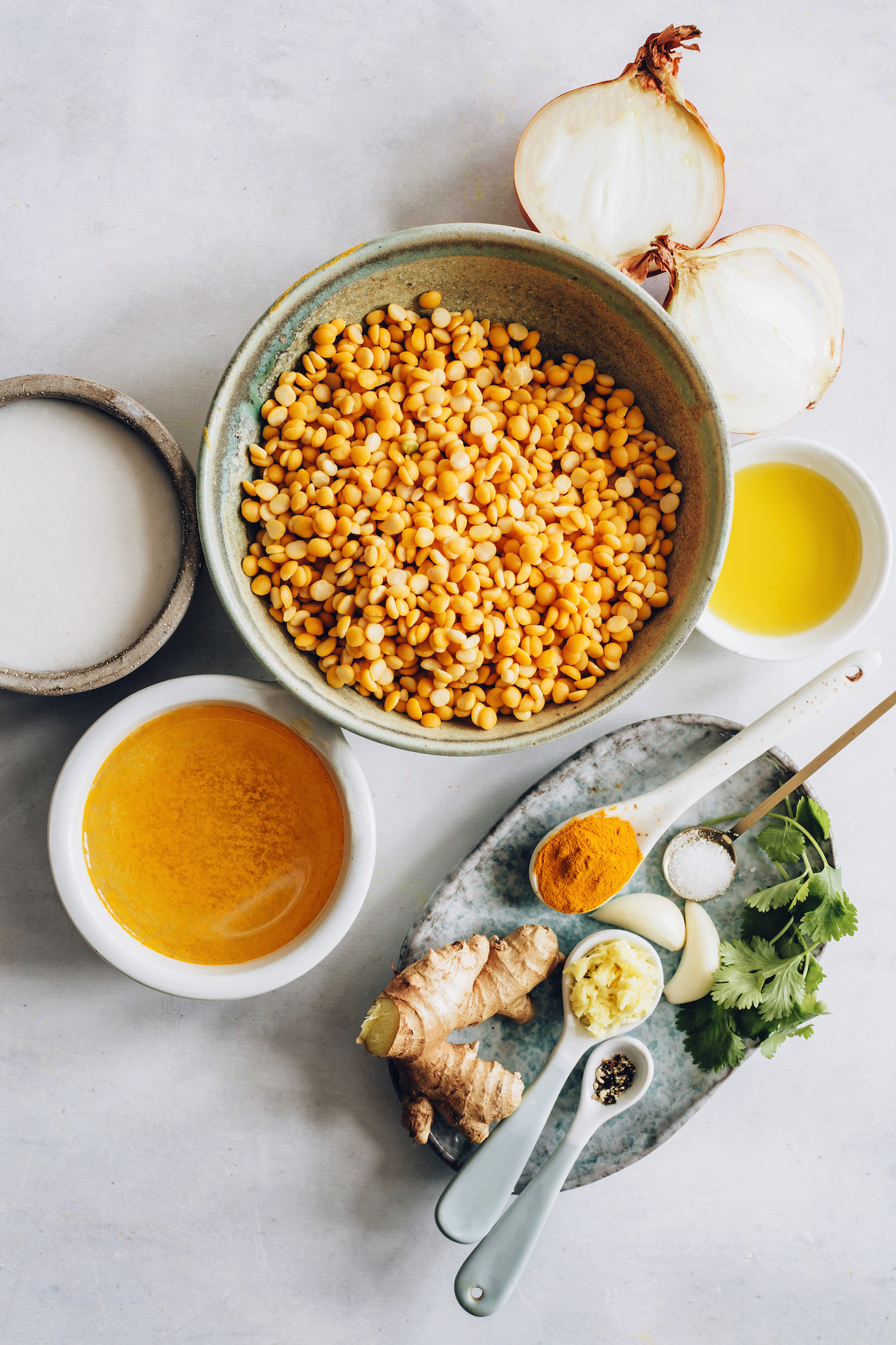 Onion, olive oil, yellow split peas, garlic, ginger, black pepper, cilantro, vegetable broth, and coconut milk