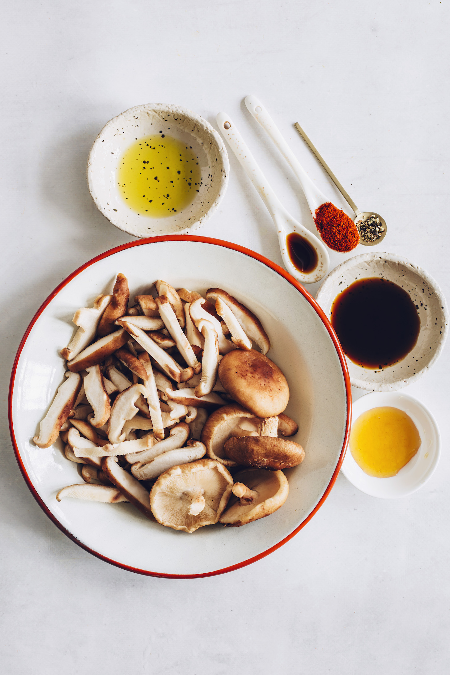 Sliced shiitake mushrooms, avocado oil, tamari, maple syrup, liquid smoke, black pepper, and smoked paprika