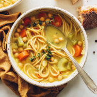 Vintage spoon in a bowl of Chickpea Noodle Soup