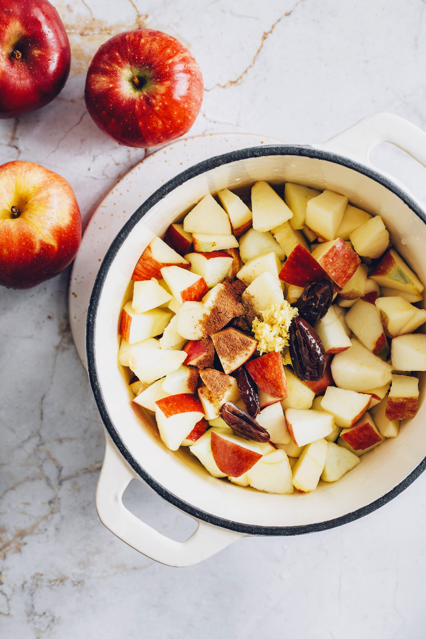 Pot of chopped apples, dates, cinnamon, and ginger