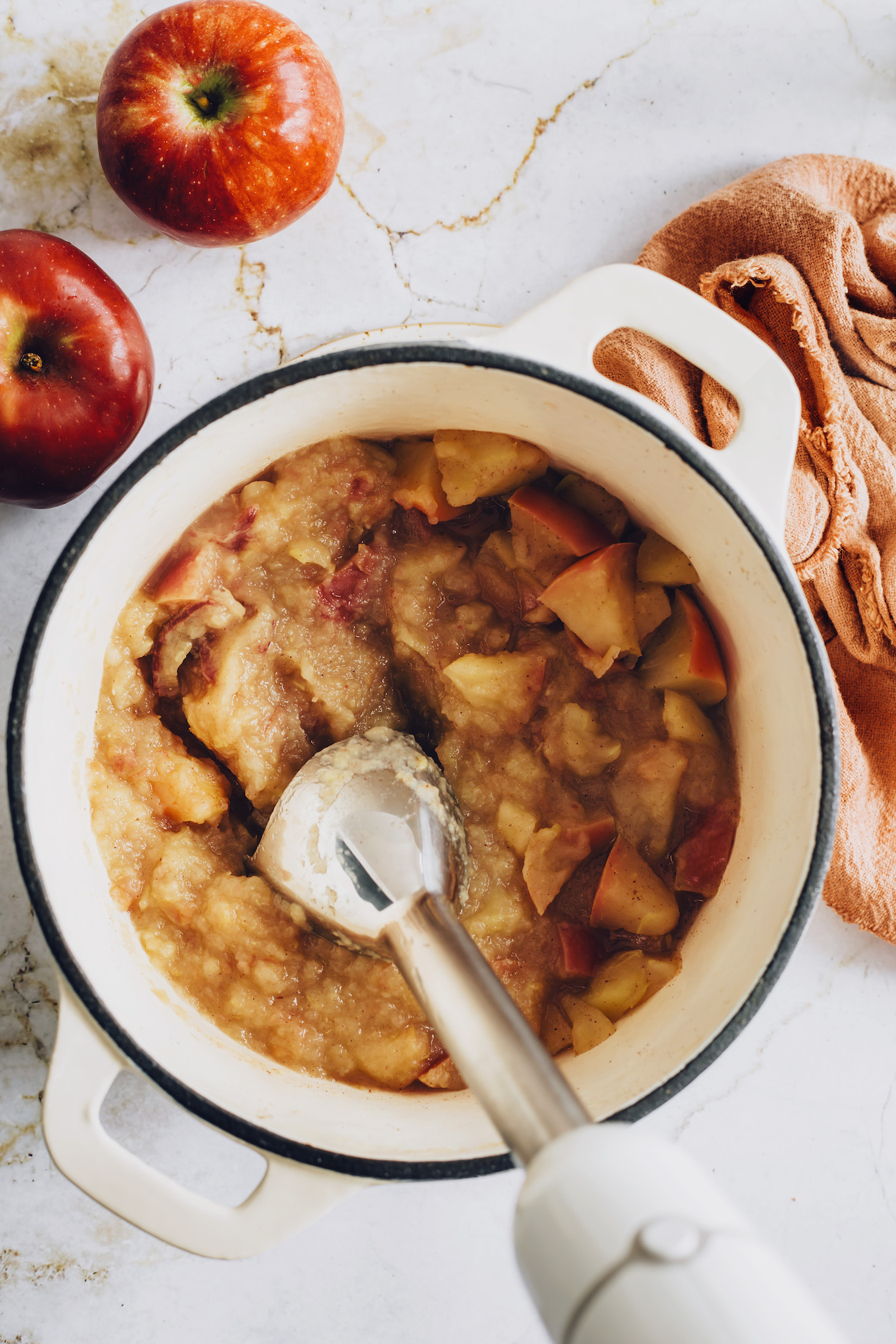 Using an immersion blender to purée apples