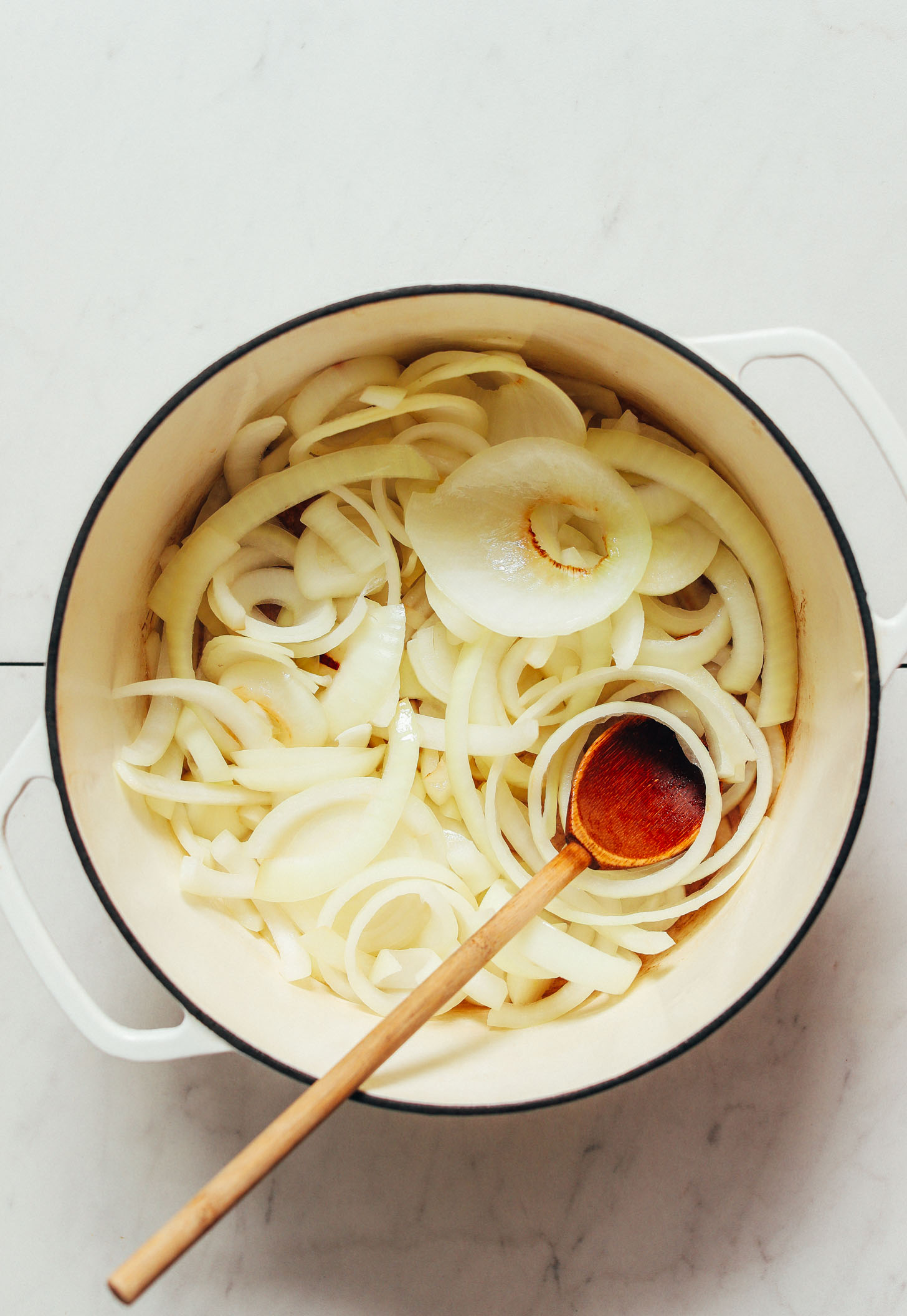 Sliced onions in a Dutch oven
