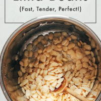 Wooden spoon in an Instant Pot of lima beans