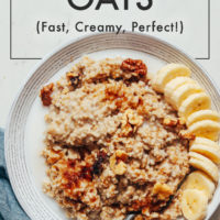 Bowl of Instant Pot Steel Cut Oats topped with nuts and fruit