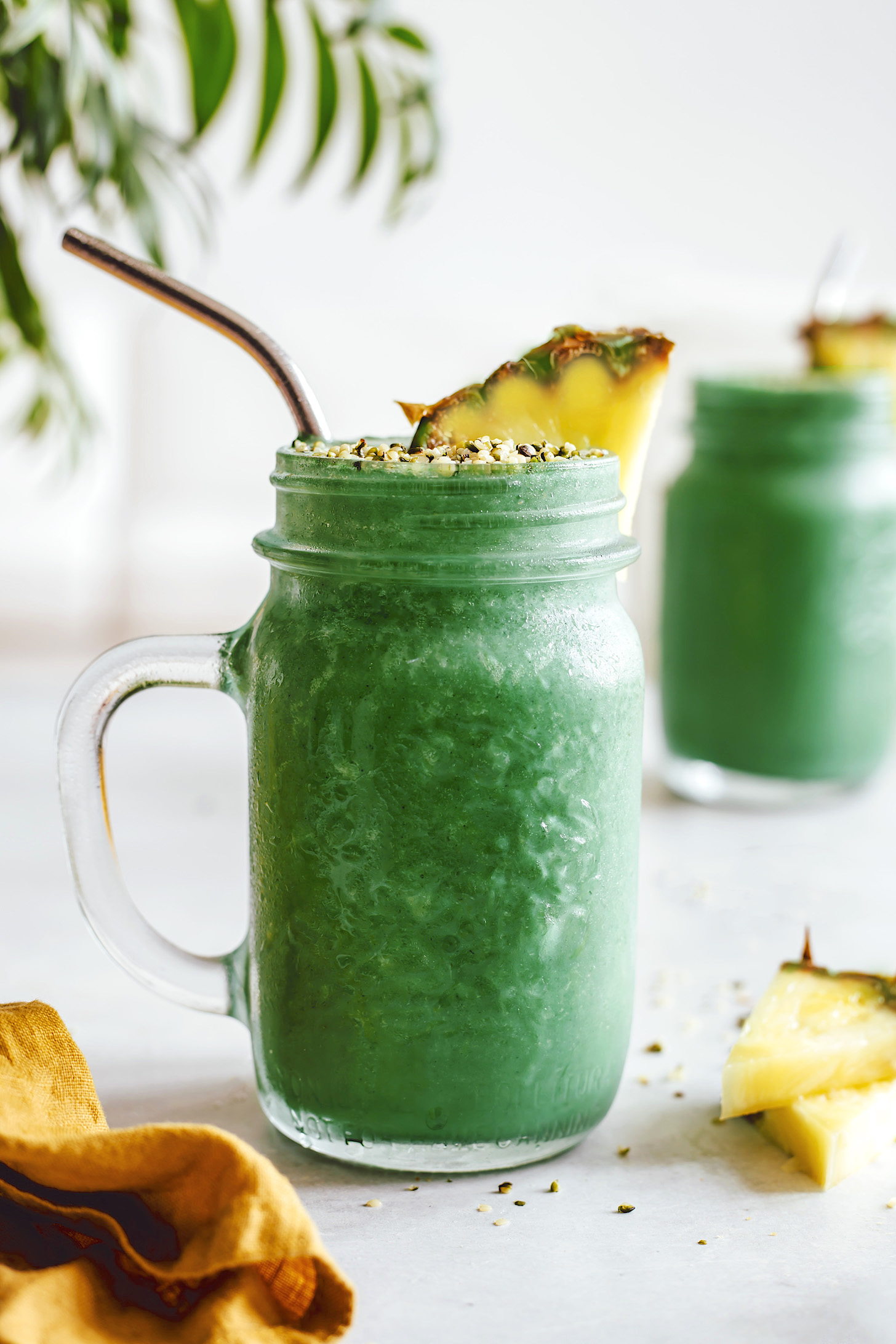 Side view of a jar of our banana pineapple green smoothie recipe