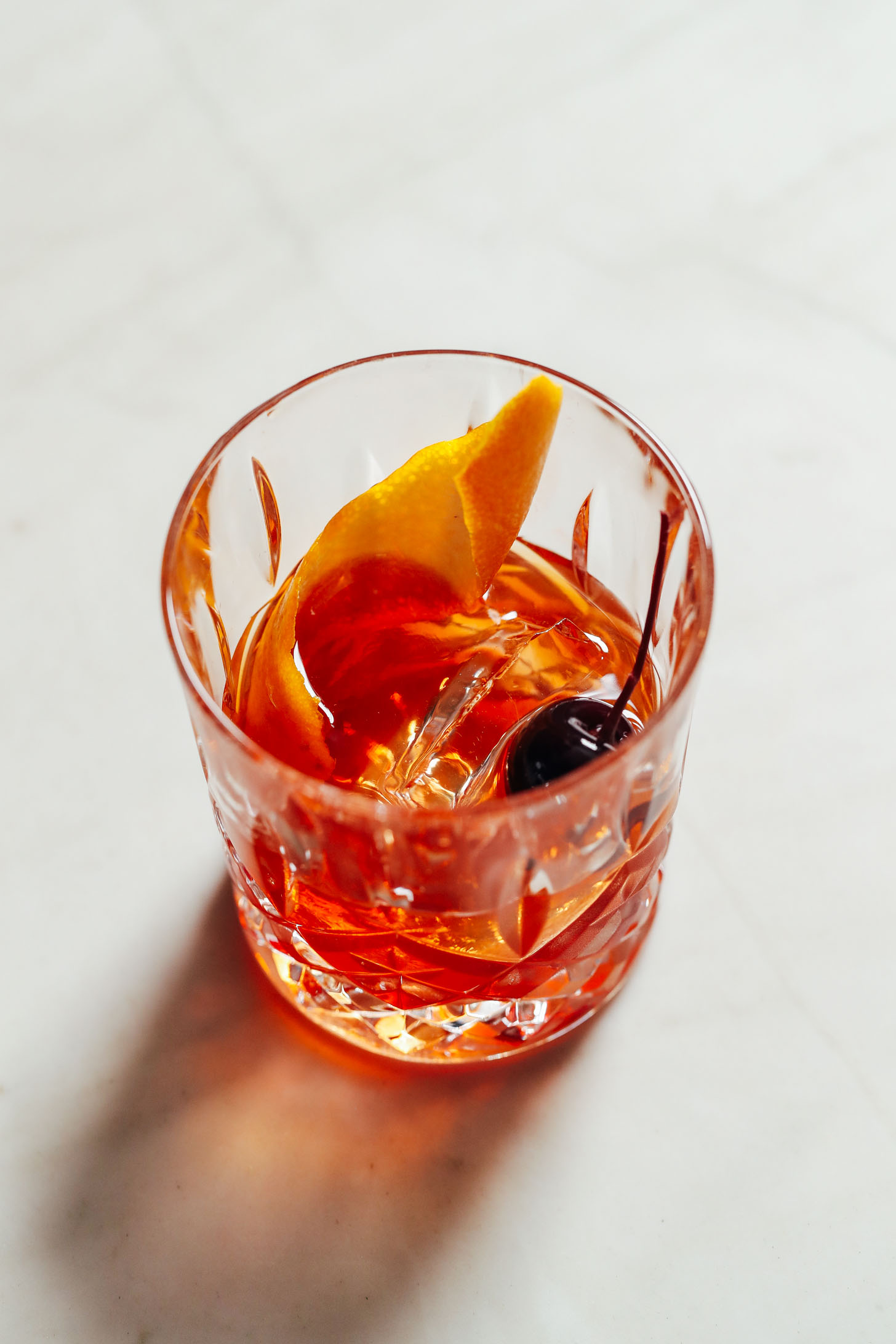 Orange peel and cocktail cherry in a Classic Old Fashioned
