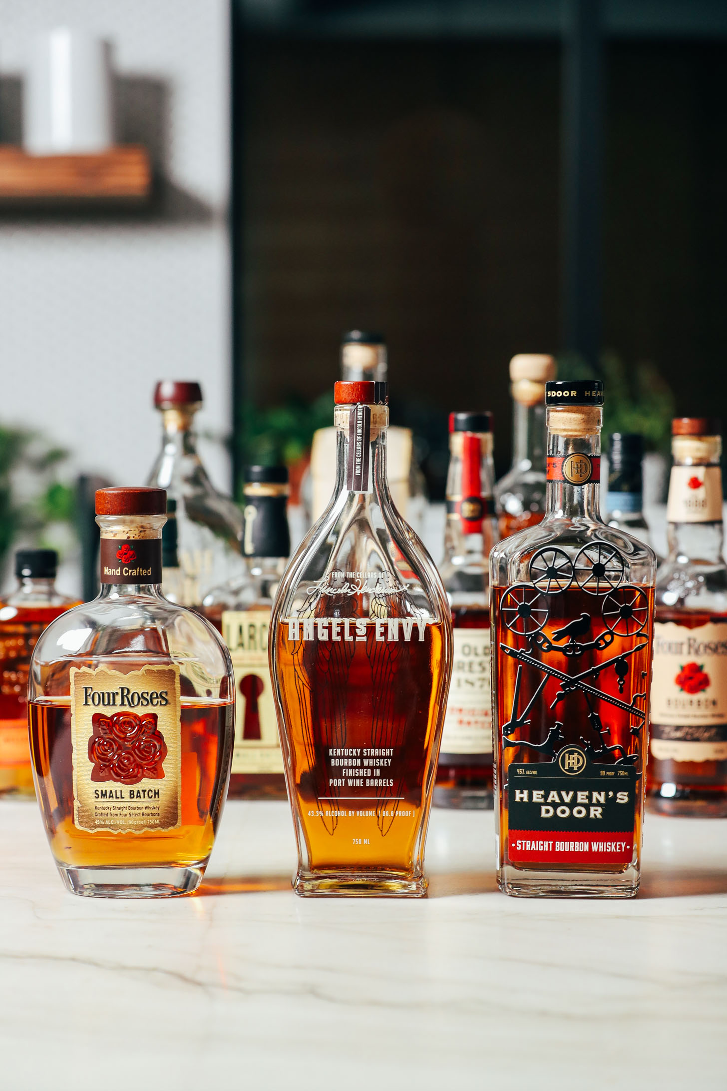 Assortment of bourbon bottles we compared for making an Old Fashioned