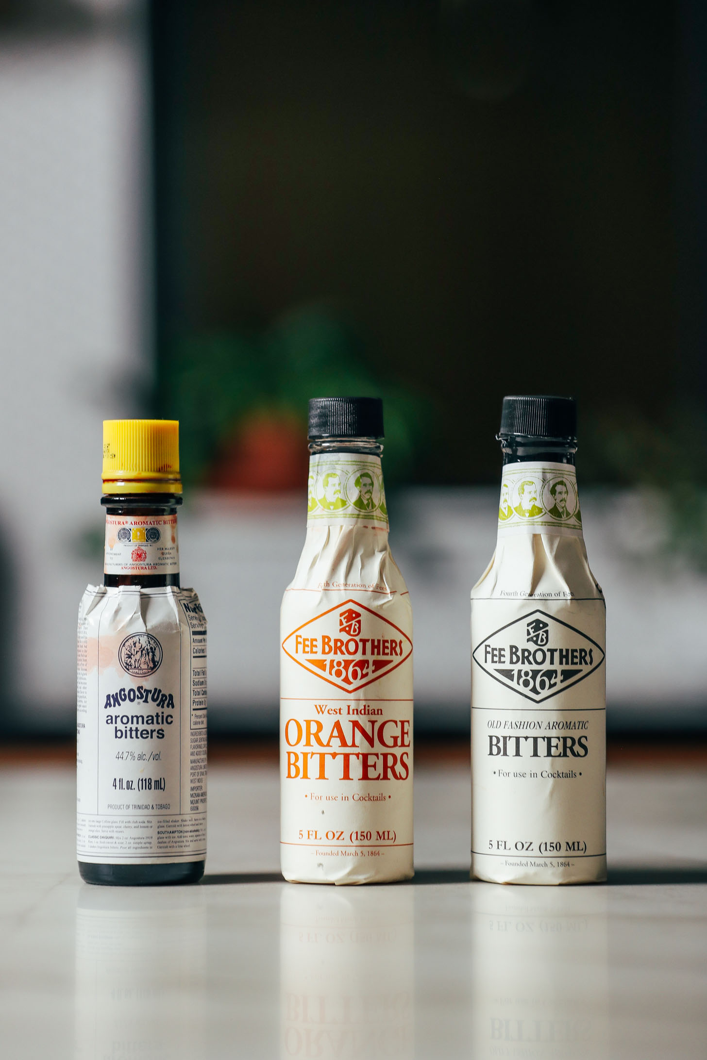 Three bottles of bitters for making an Old Fashioned