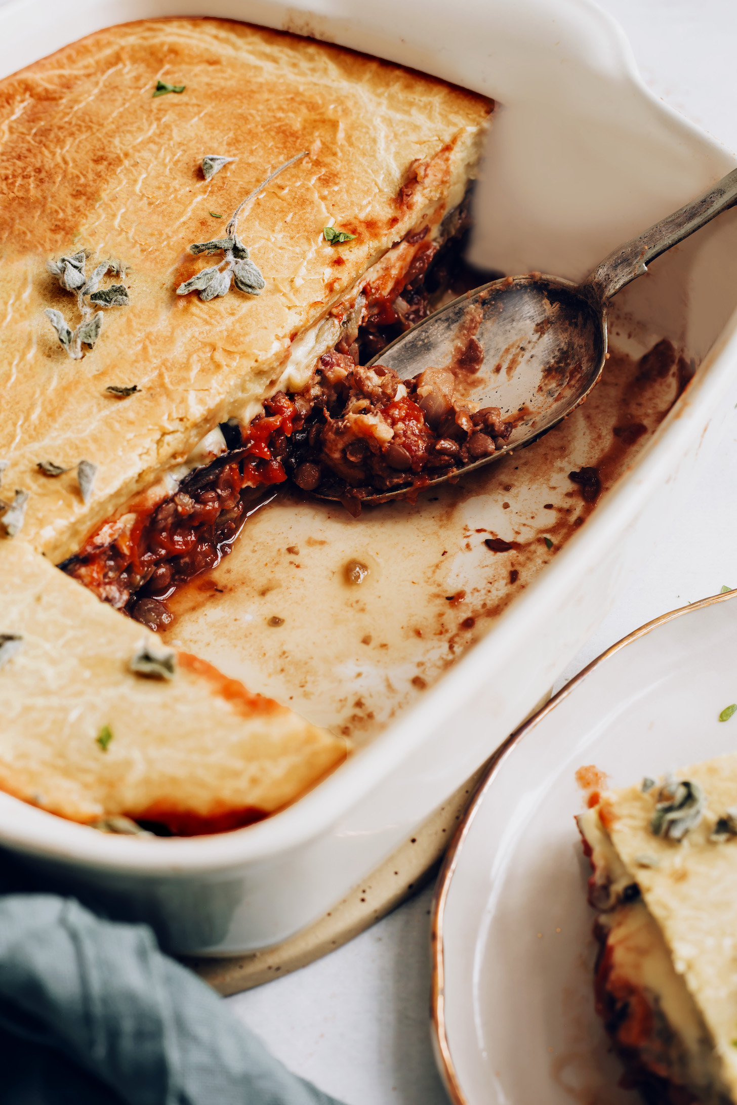Vintage spoon in a pan of easy vegan moussaka