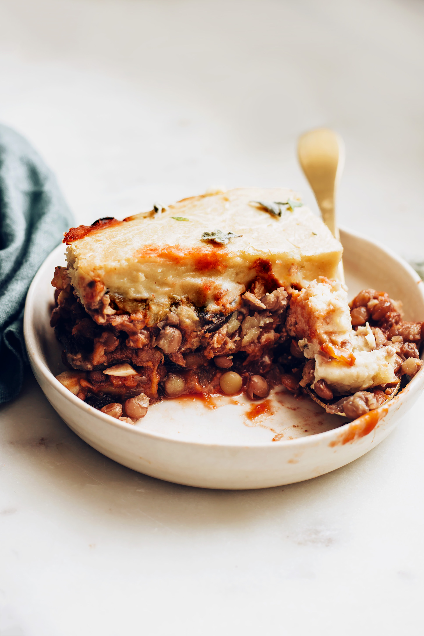 Vegan moussaka with a lentil base and cashew topping