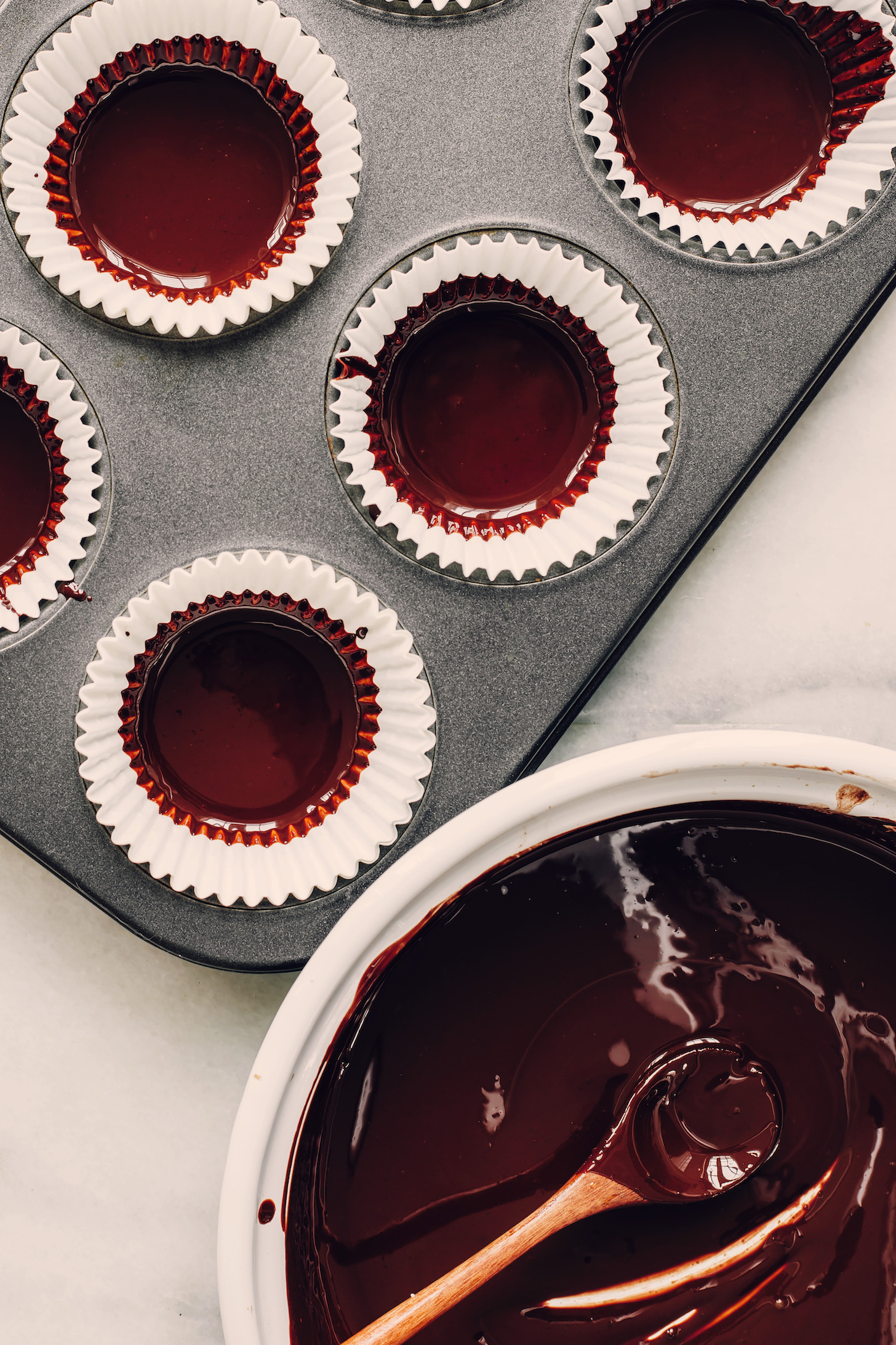 Mini muffin tins lined with melted chocolate