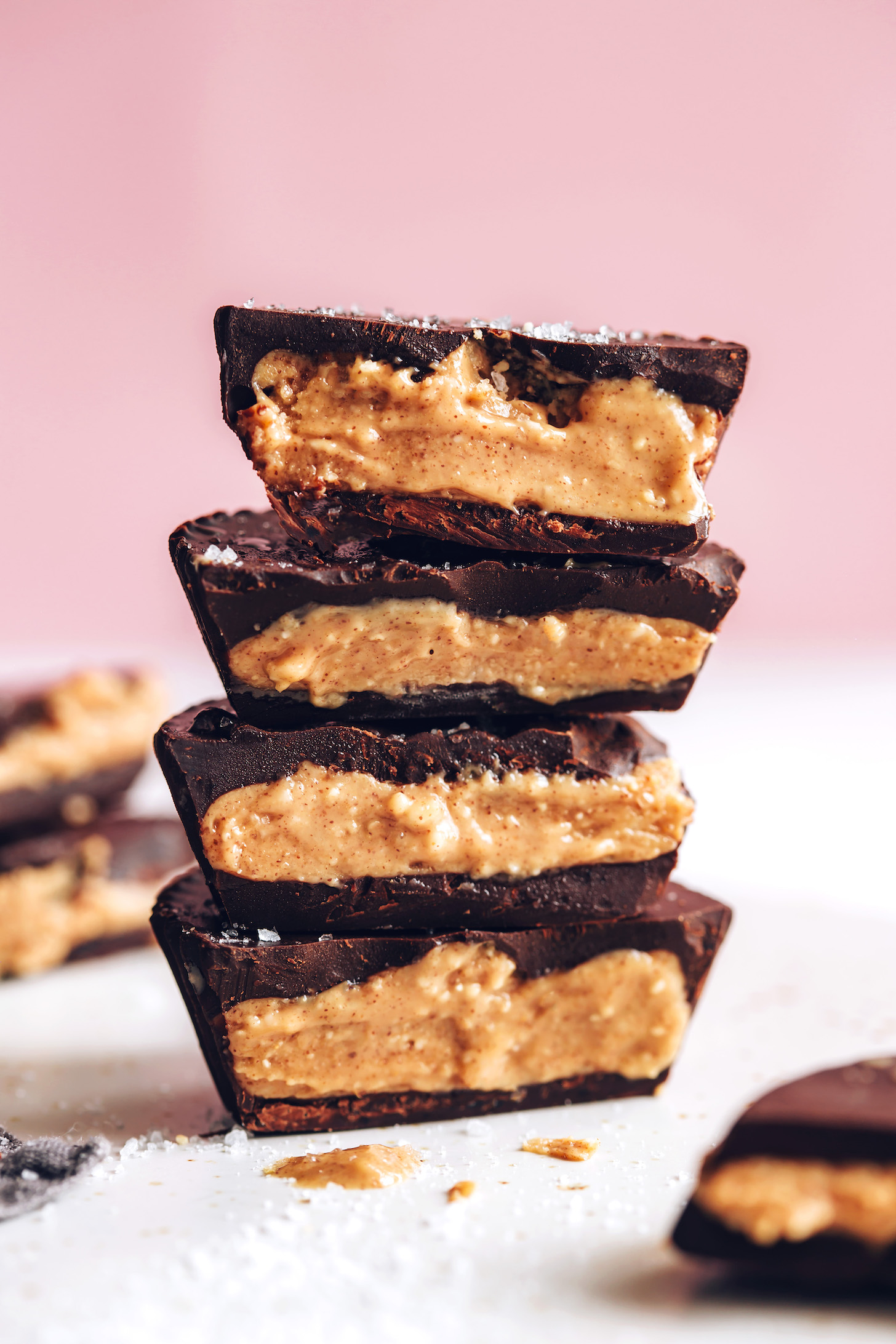Stack of easy homemade peanut butter cups cut in half