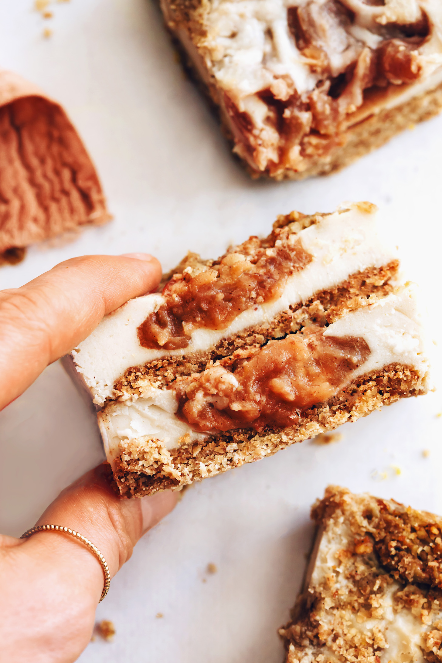 Two squares of apple butter cheesecake bars