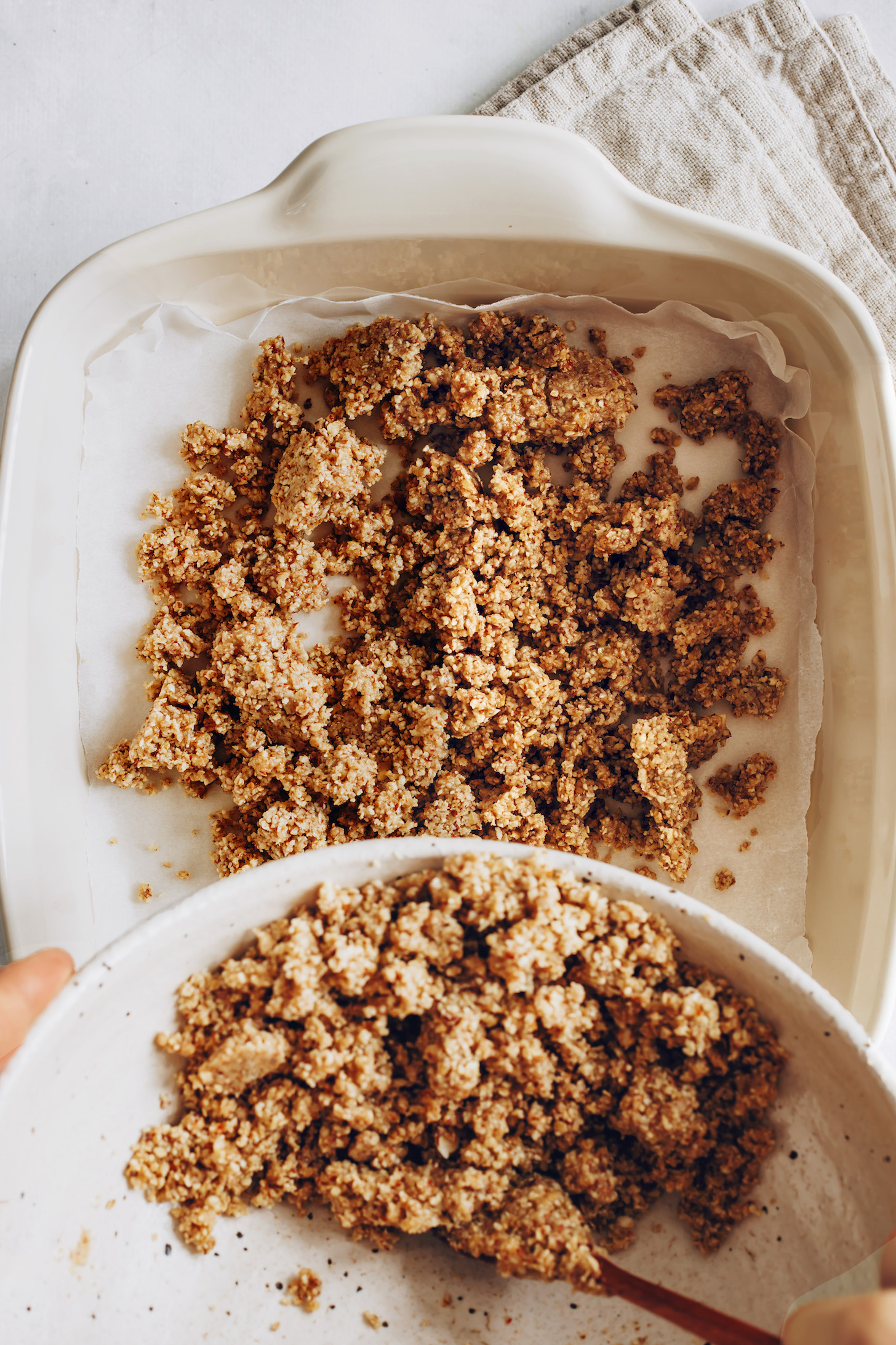 Adding crust to a parchment-lined baking pan